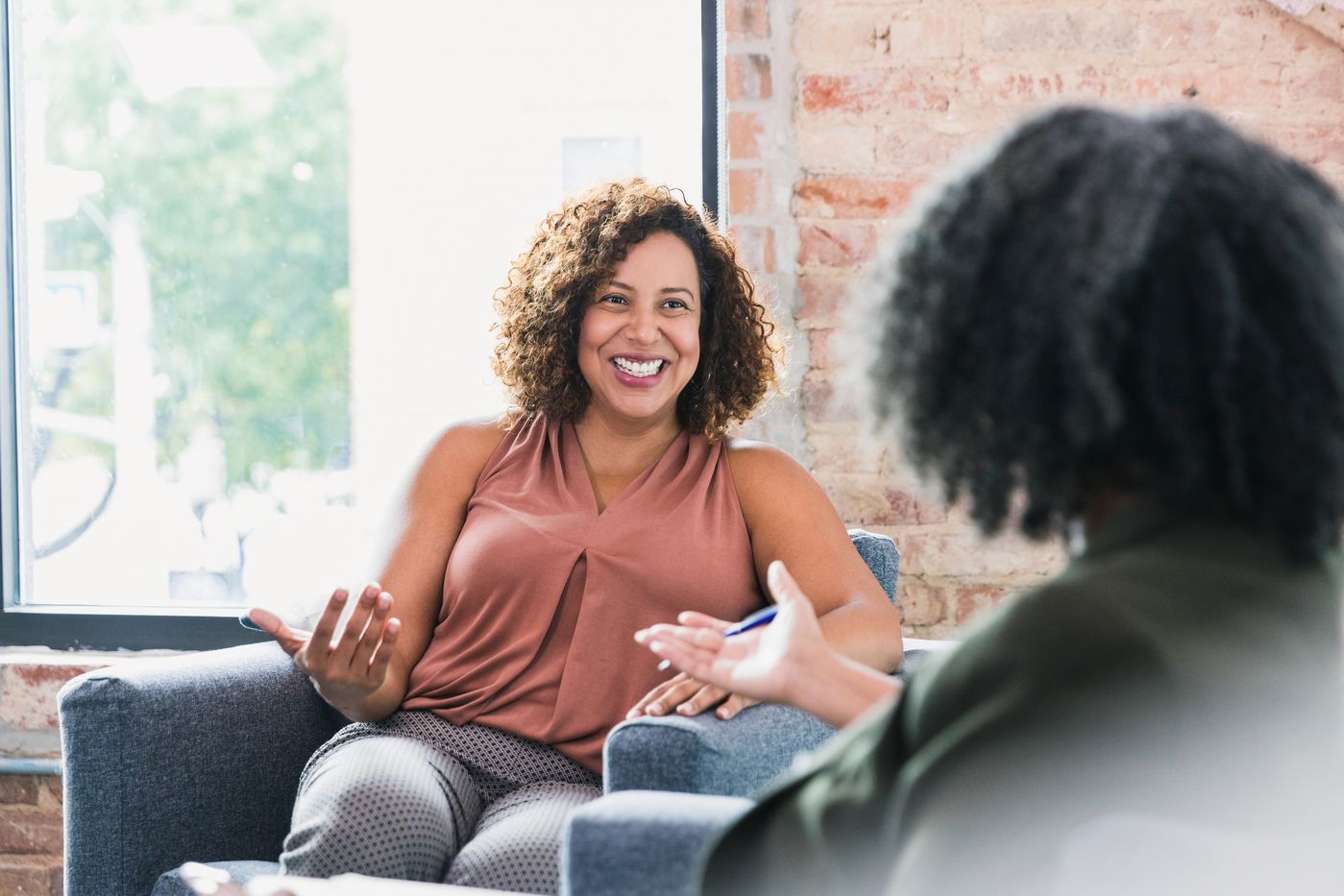 Client smiling during a progress check-in session