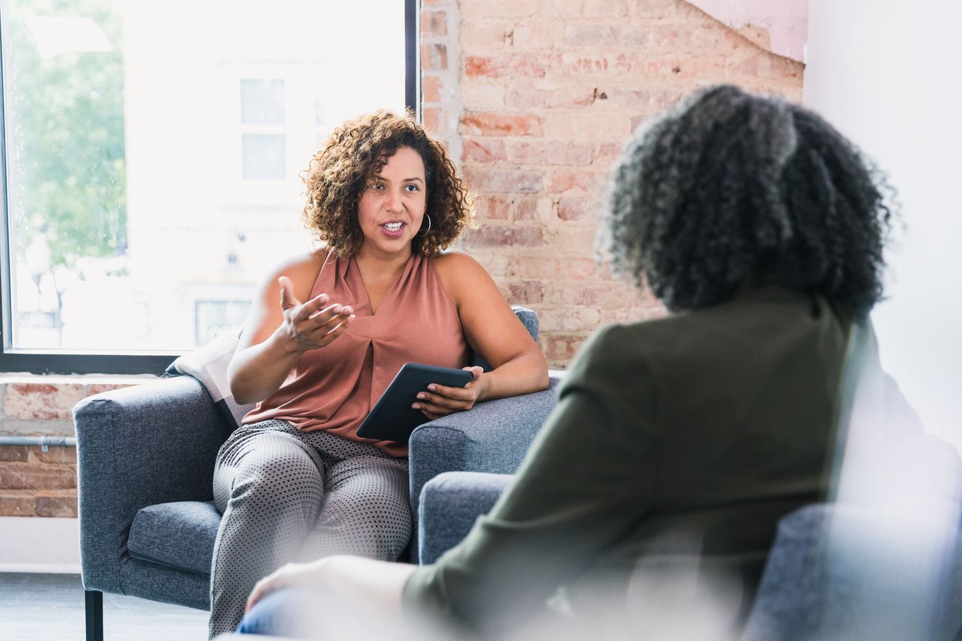 Coach and client in conversation during a review session